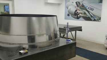 quality-control-room-with-metal-equipment-and-aerospace-photograph
